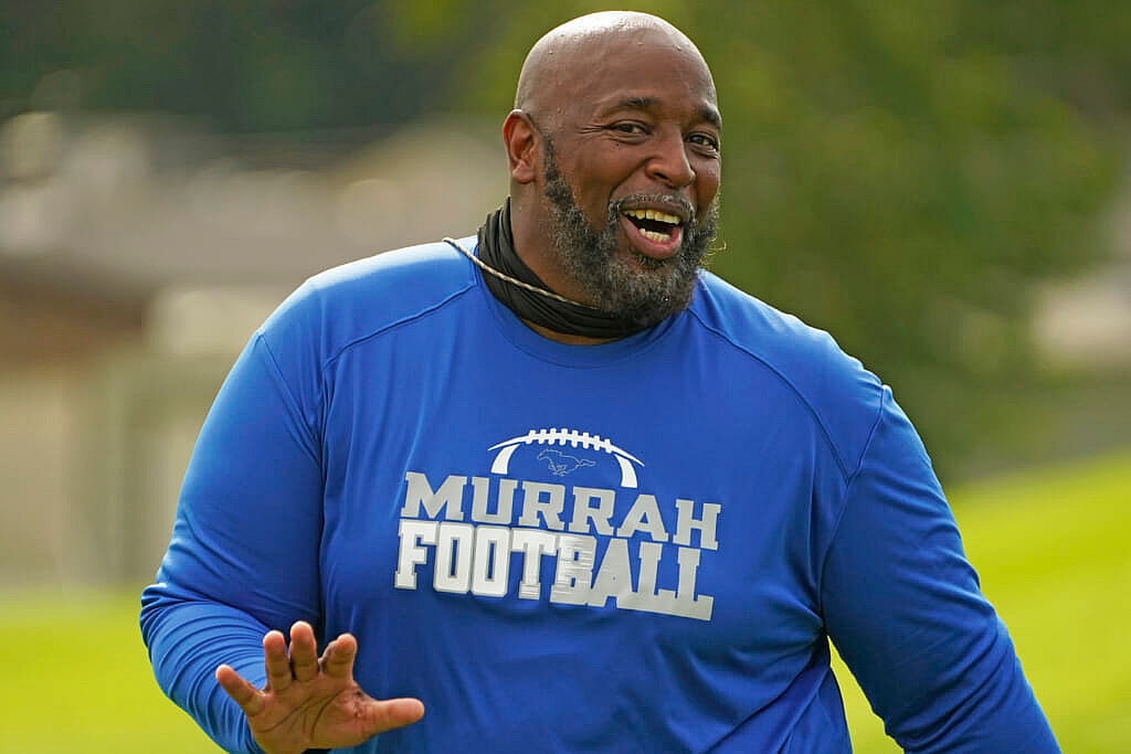 Murrah High School football coach Marcus Gibson wearing a blue Murrah Football shirt