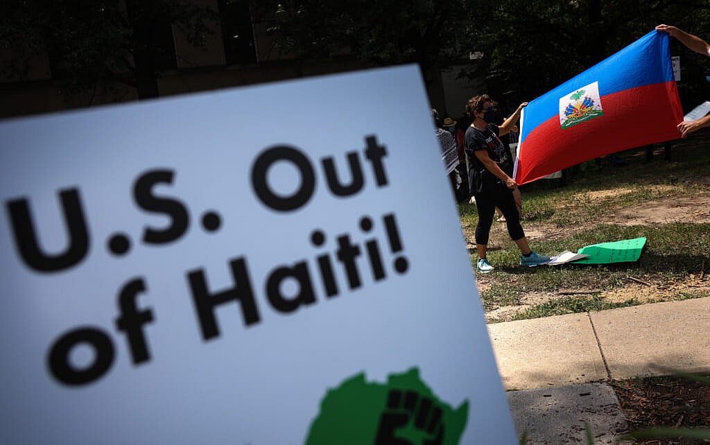 Activists with Black Alliance For Peace hold a rally against U.S. intervention in Haiti