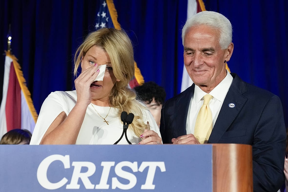 Democratic gubernatorial candidate Rep. Charlie Crist, right, with his fiancee Chelsea Grimes