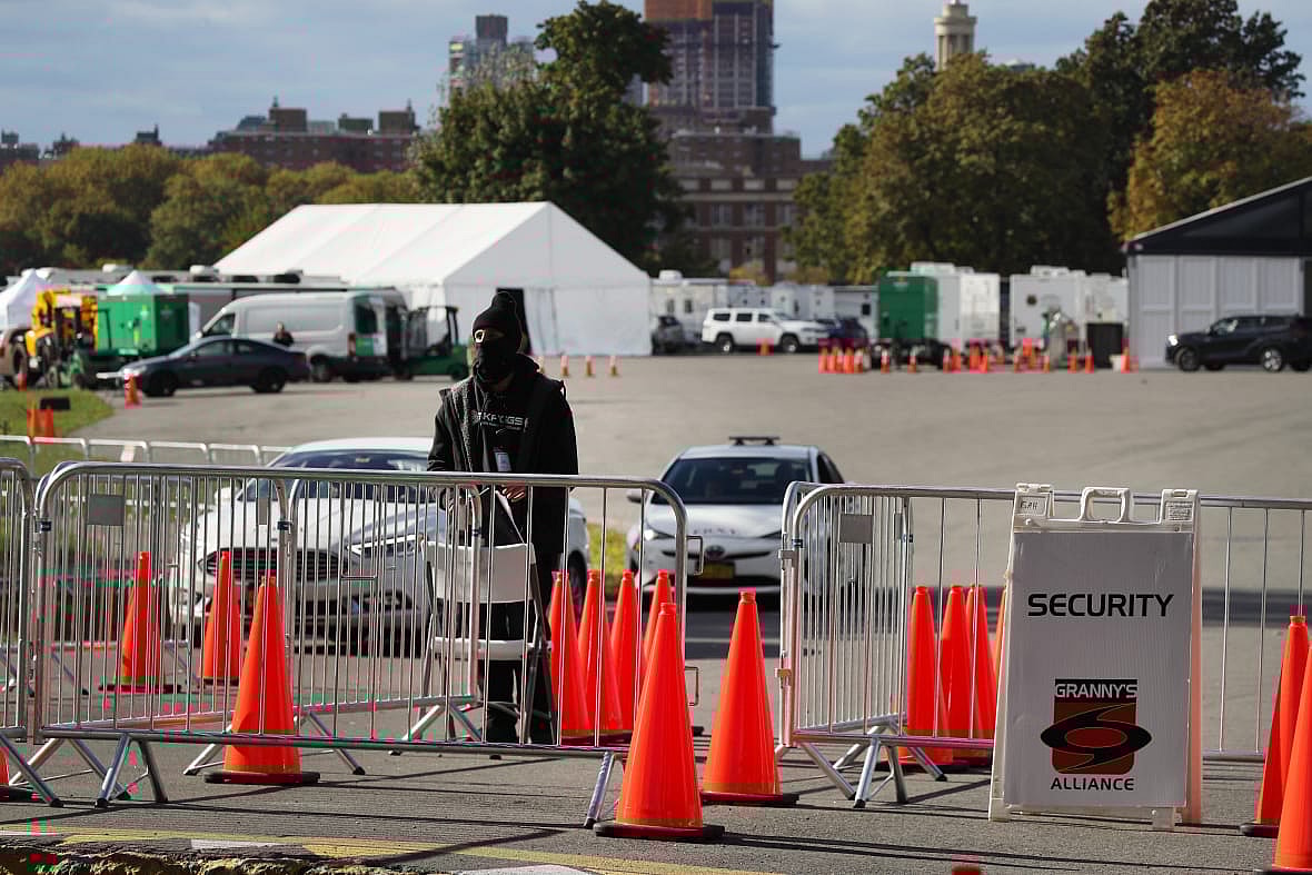 Security fencing in front of tent shelters