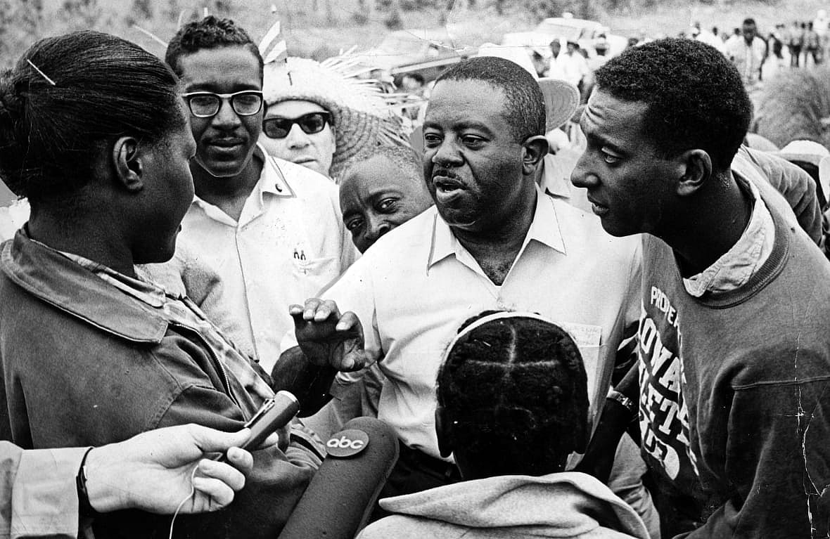 Ralph Abernathy, center, with Stokely Carmichael, right, addresses students in 1966