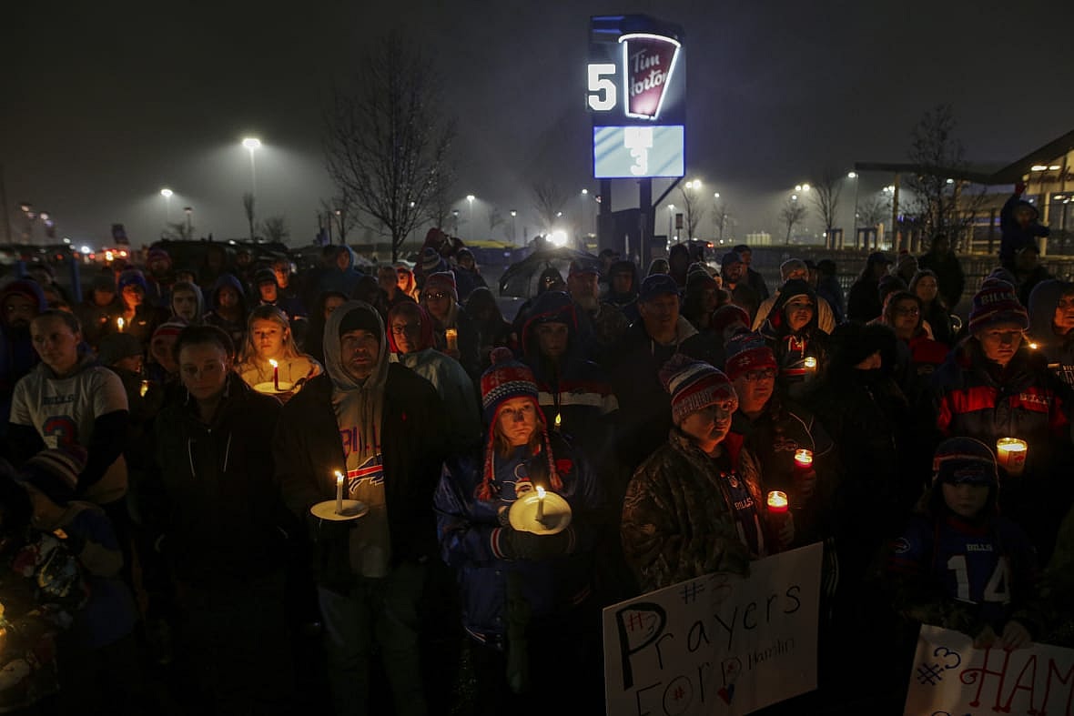 Buffalo Bills fans and community members gather for a candlelight vigil for Buffalo Bills safety Damar Hamlin