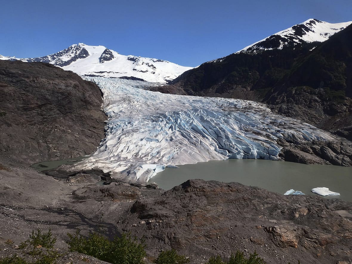 Chunks of ice float on Mendenhall Lake in front of the Mendenhall Glacier
