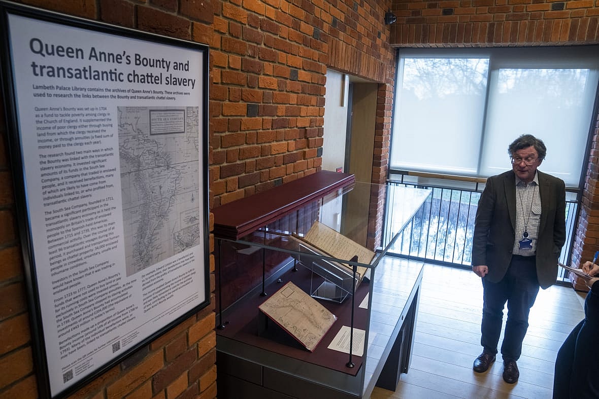 Church of England archivist Giles Mandelbrote near a display on slavery