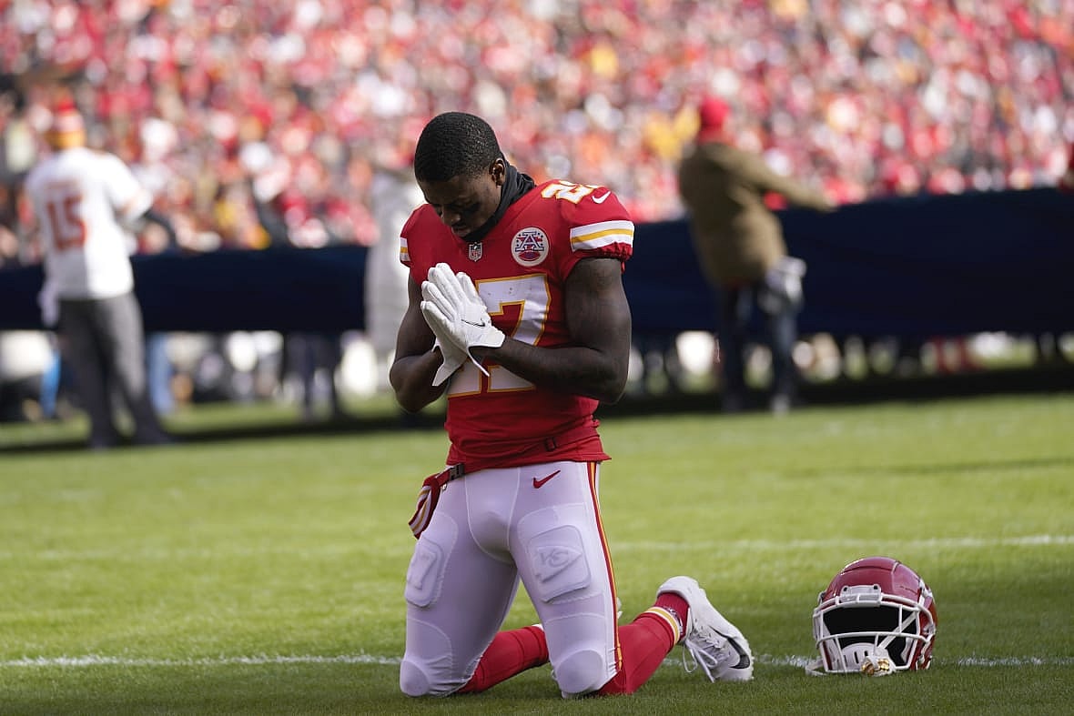 Kansas City Chiefs cornerback Rashad Fenton kneels on the field