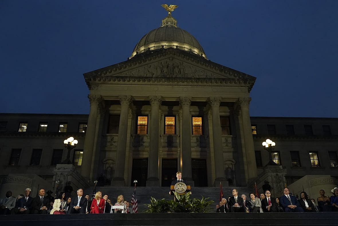 Mississippi Gov. Tate Reeves, center, speaks during his State of the State address