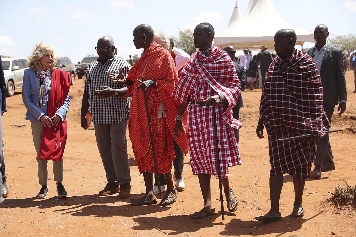 First Lady Jill Biden greets members of the Maasai community as they explain the drought situation in Kenya