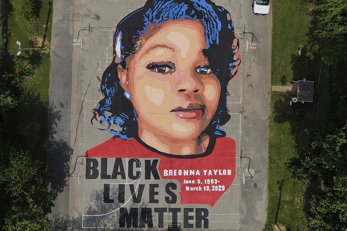 A ground mural depicting a portrait of Breonna Taylor