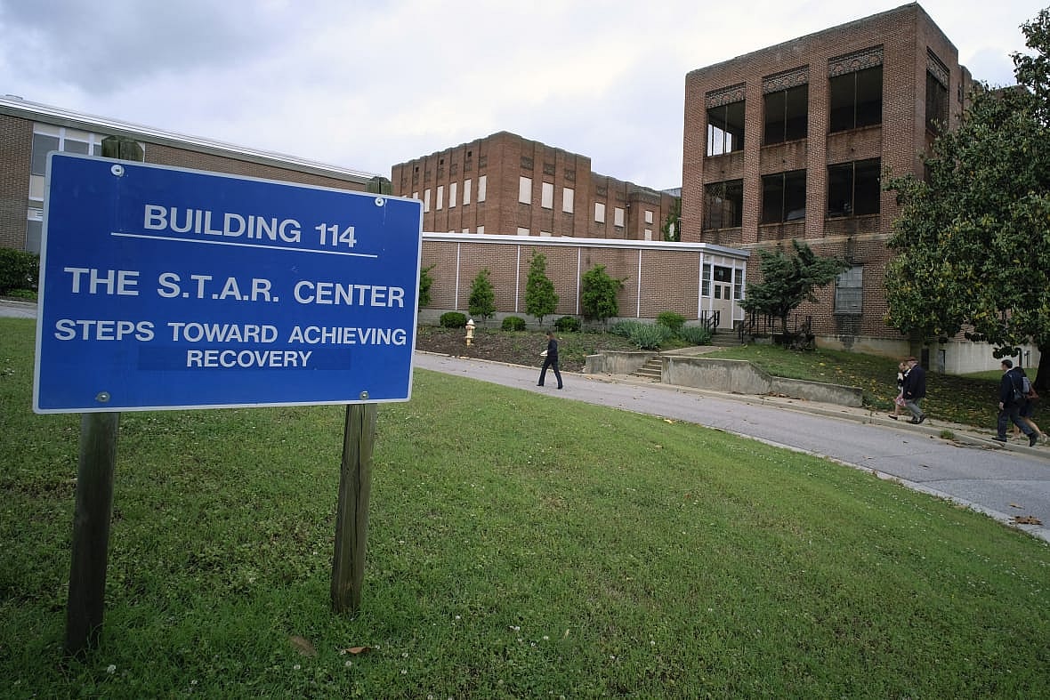 Visitors walk toward Building 114, the S.T.A.R. Center, at Central State Hospital
