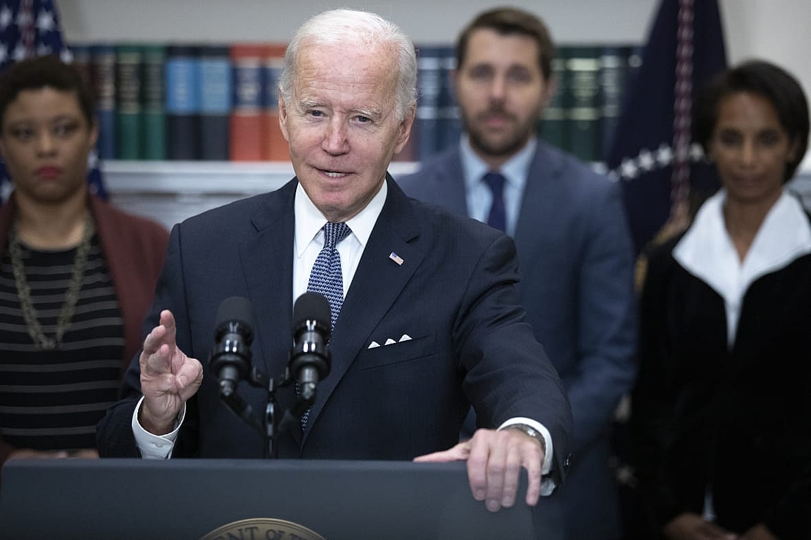 President Joe Biden speaks in front Shalanda Young, Brian Deese and Cecilia Rouse