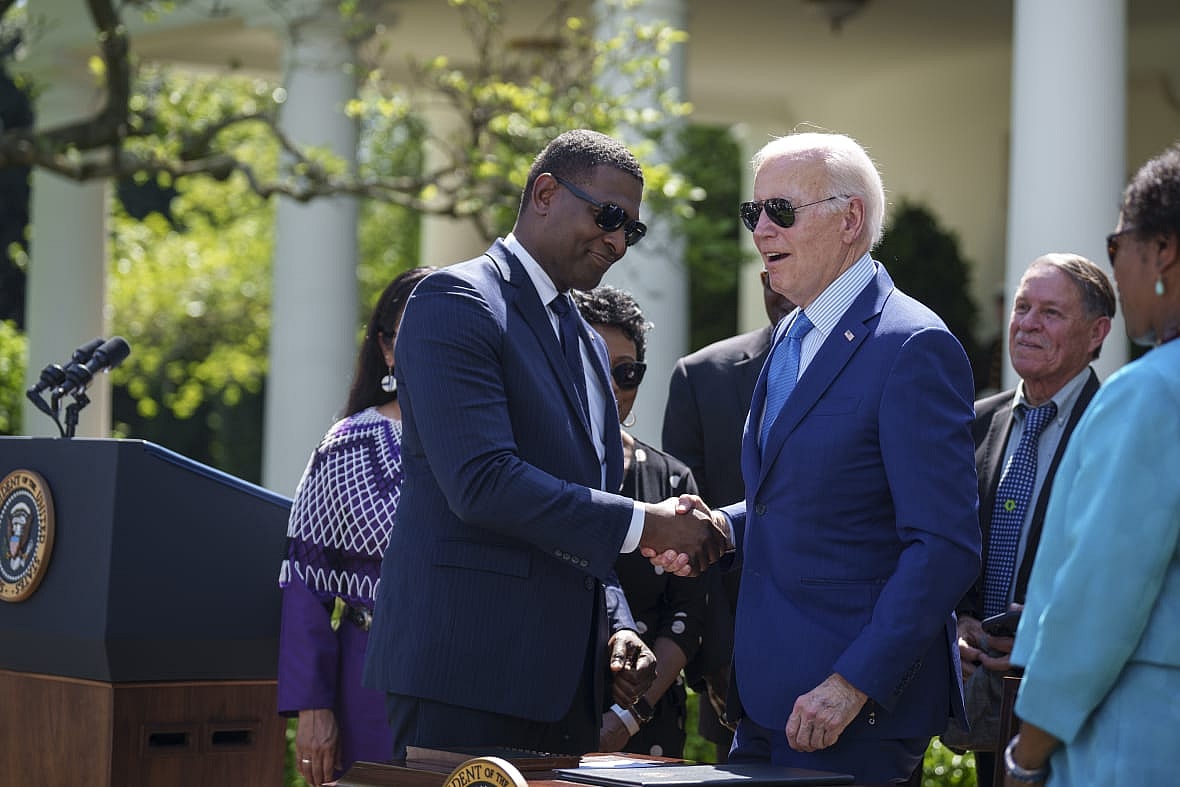 EPA Administrator Michael Regan and President Joe Biden shake hands