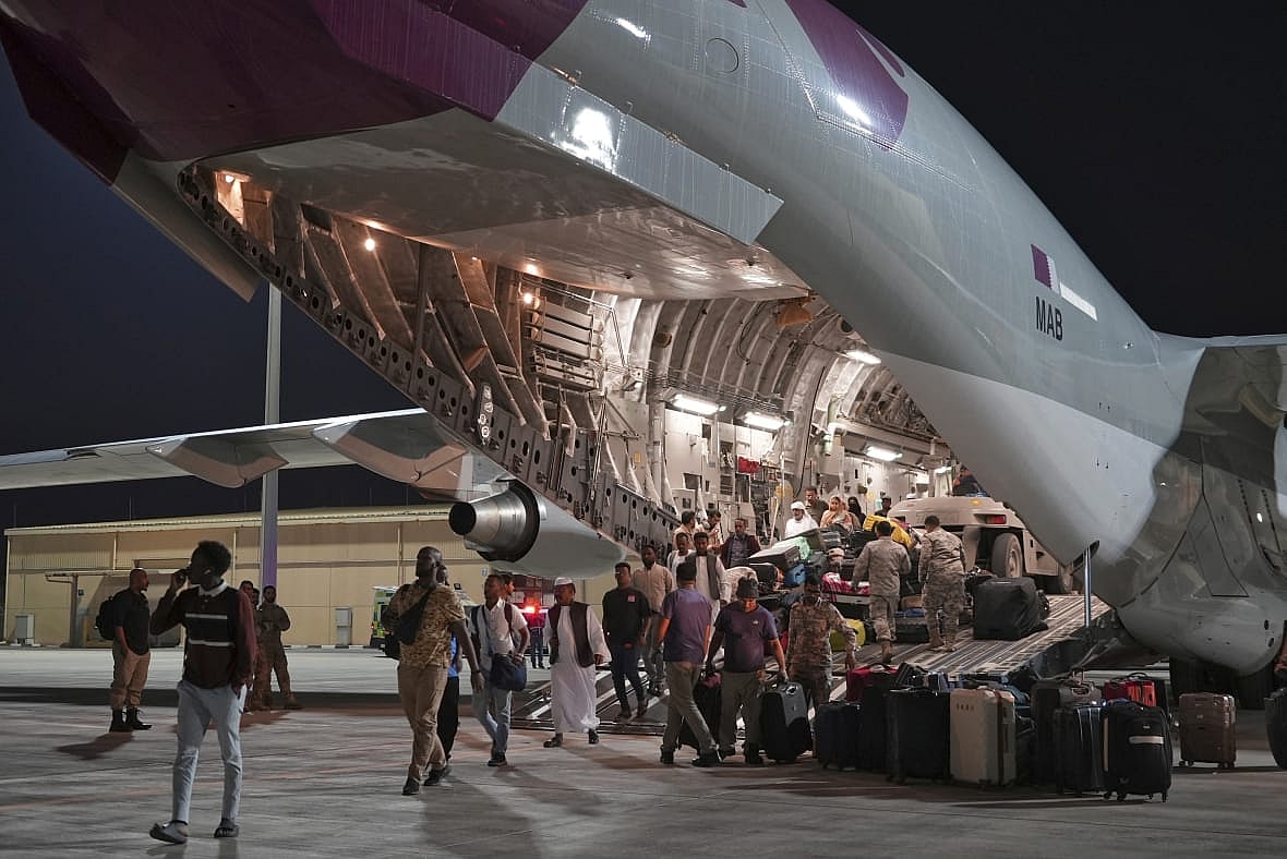 Evacuees flown out of Sudan disembark