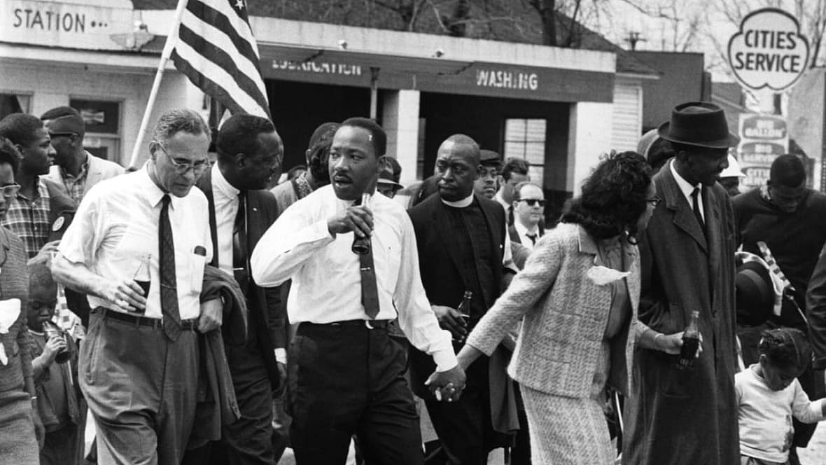 Dr. Martin Luther King Jr. and his wife, Coretta Scott King, lead a civil rights march