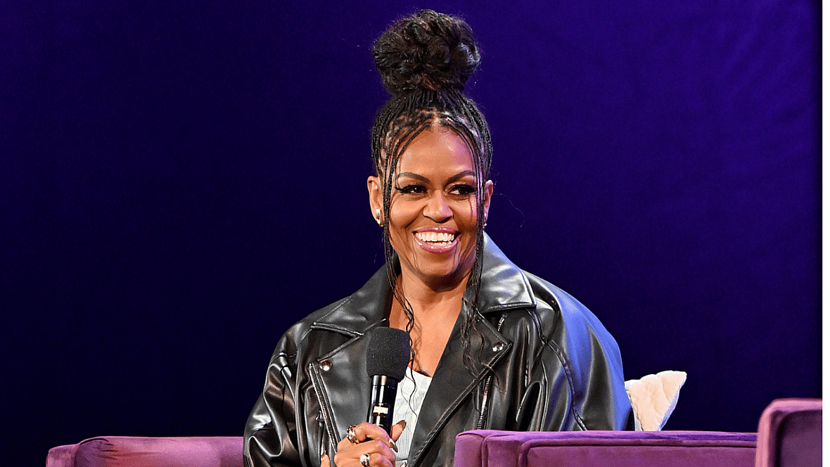 Former First Lady Michelle Obama with a microphone