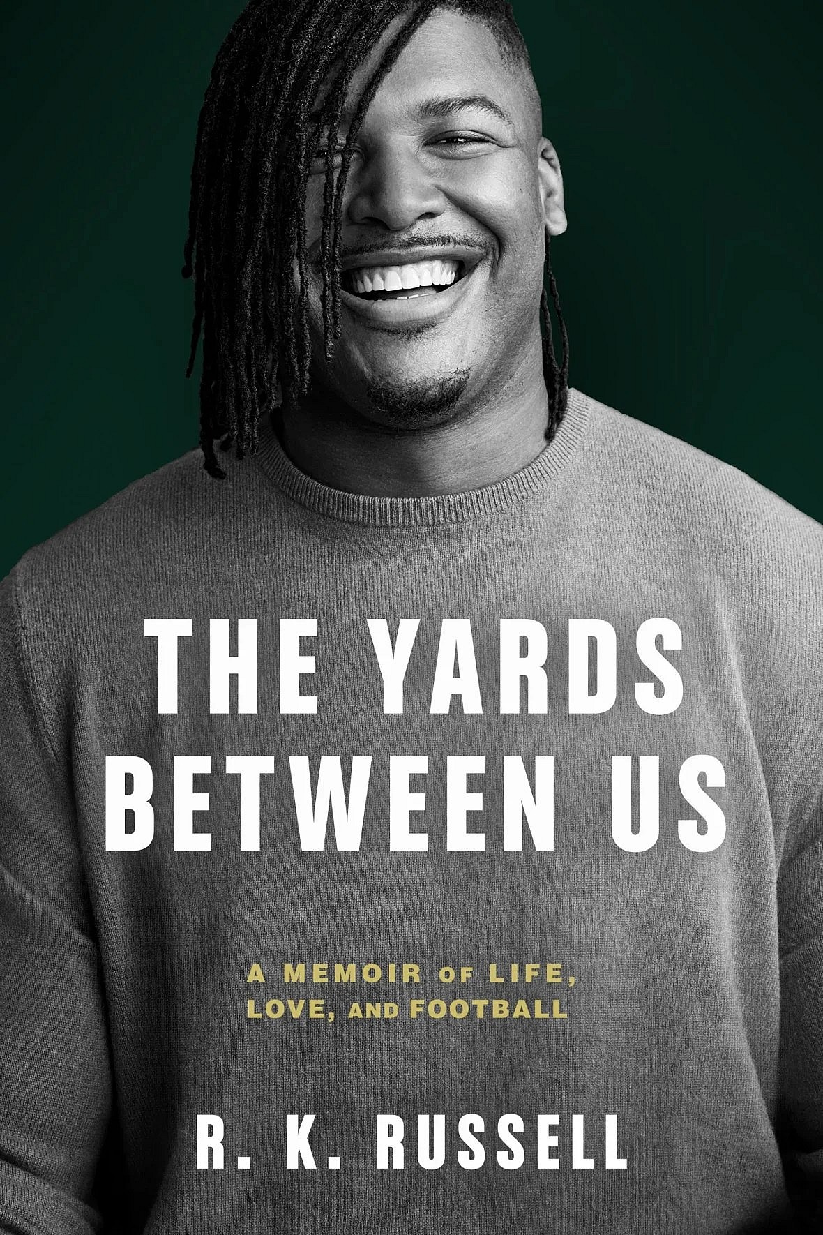 The cover of the book "The Yards Between Us" by NFL player R.K. Russell depicts the author in black and white