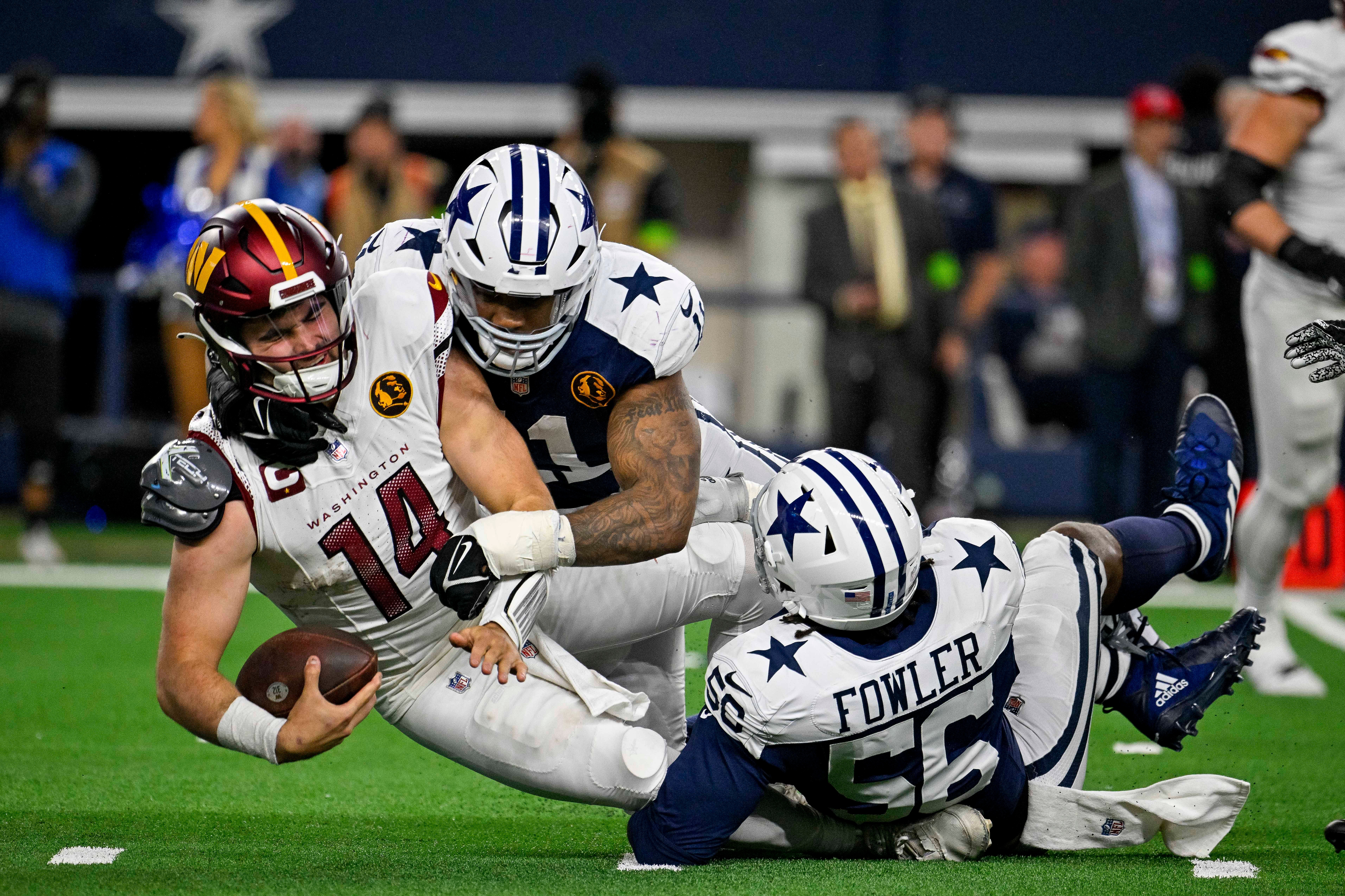 Dallas Cowboys Micah Parsons and Dante Fowler Jr. sack Washington Commanders quarterback Sam Howell