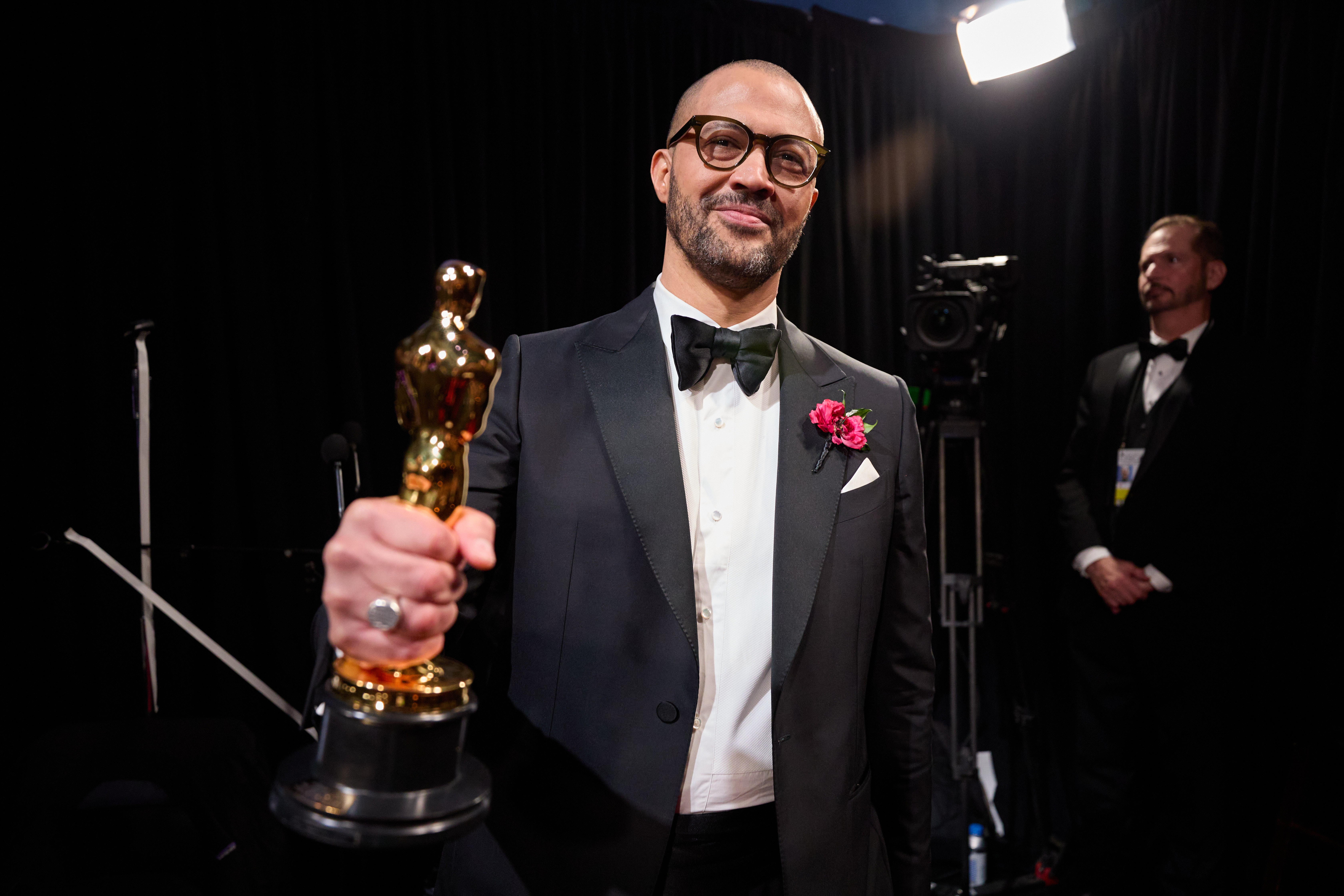 Writer and director Cord Jefferson with his Oscar