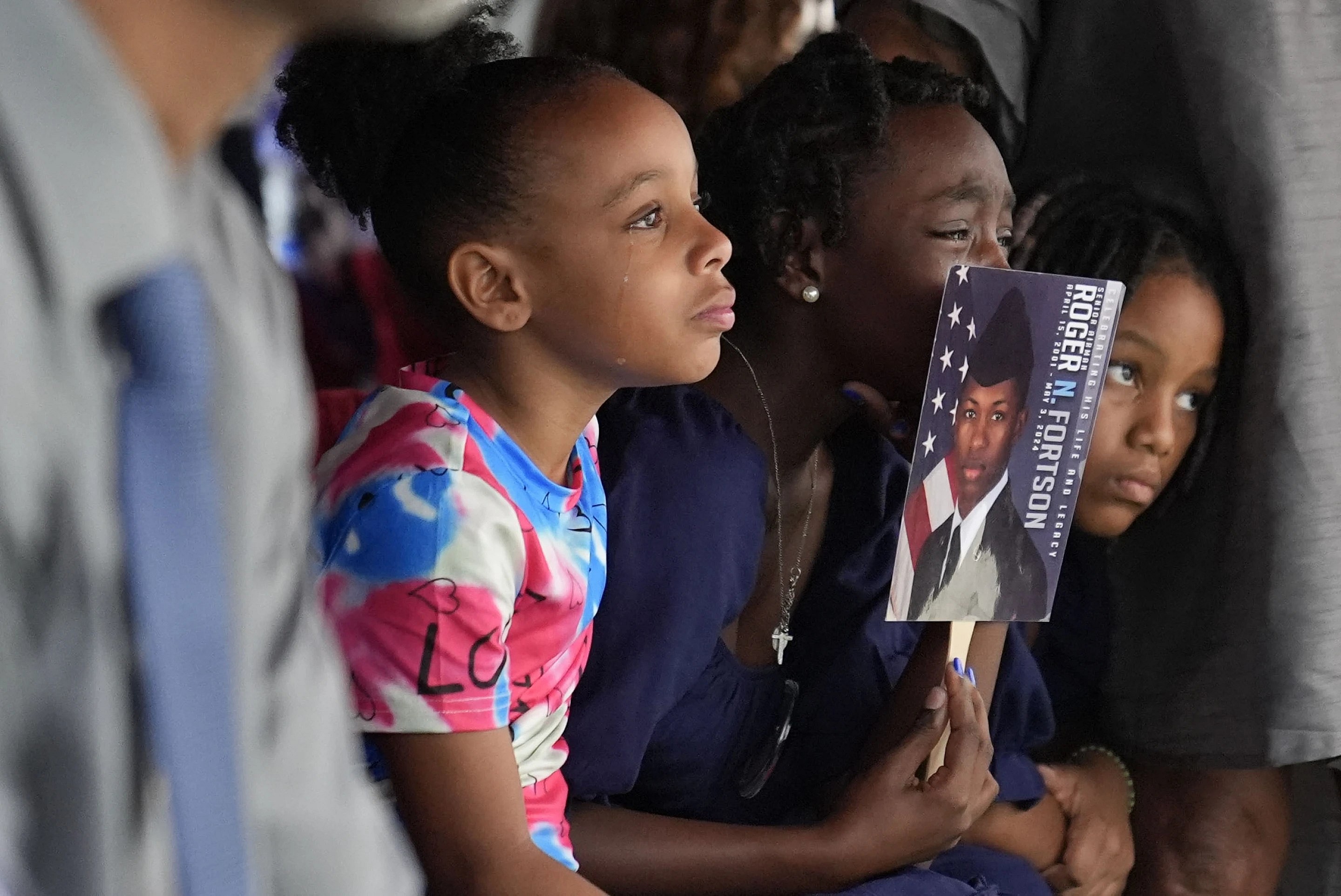 Family members cry for slain airman Roger Fortson