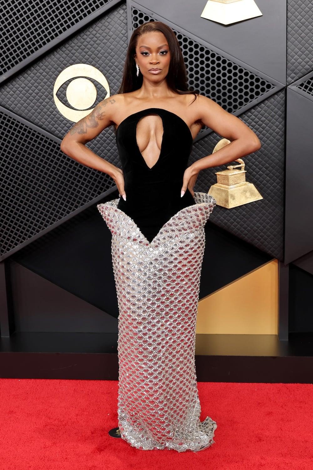  Ari Lennox attends the 68th GRAMMY Awards at Crypto.com Arena on February 01, 2026 in Los Angeles, California wearing a two-toned black velvet and silver metallic column gown from Valdrin Sahiti