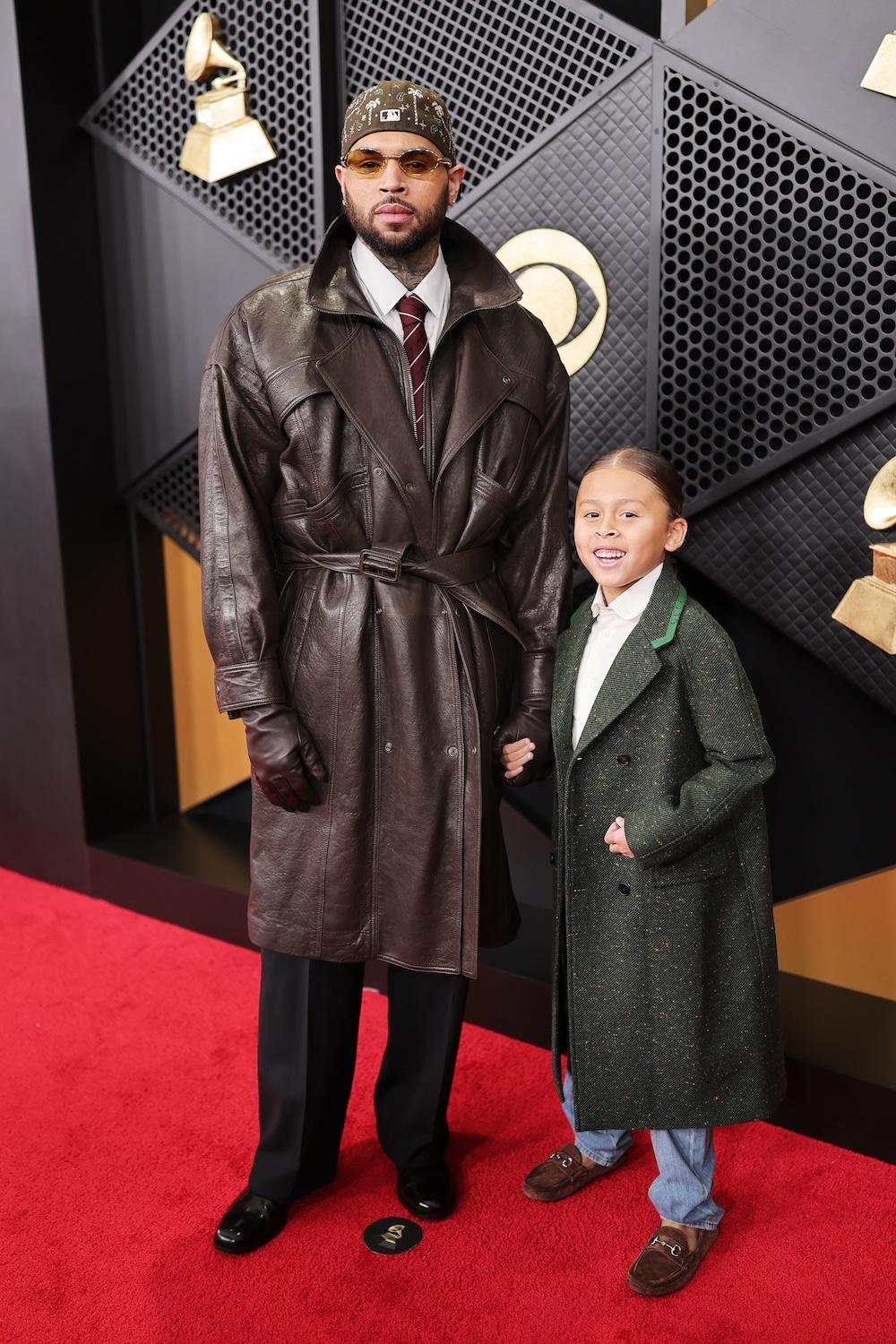 LOS ANGELES, CALIFORNIA - FEBRUARY 01: Chris Brown (L) and a guest attend the 68th GRAMMY Awards on February 01, 2026 in Los Angeles, California.