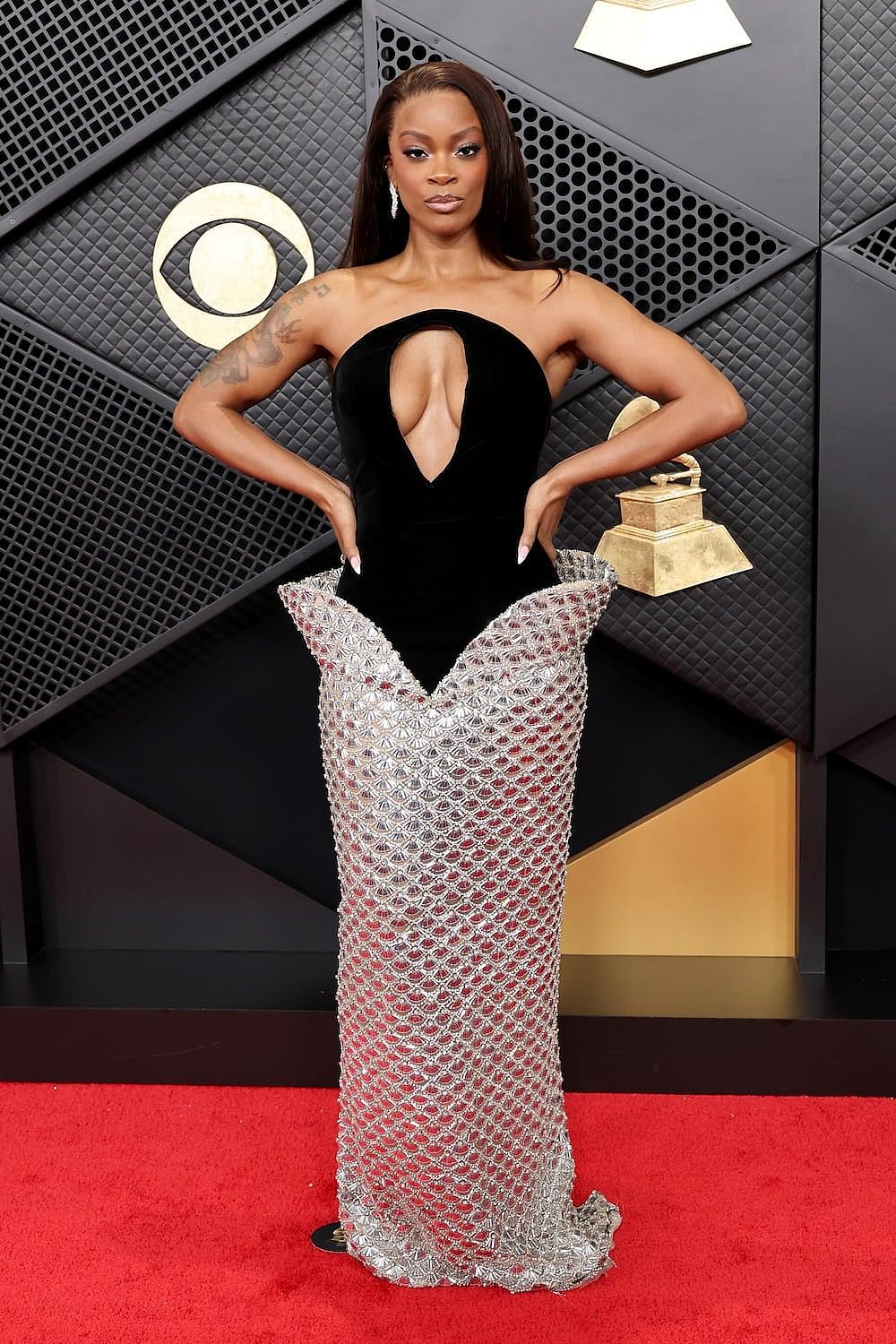  Ari Lennox attends the 68th GRAMMY Awards at Crypto.com Arena on February 01, 2026 in Los Angeles, California wearing a two-toned black velvet and silver metallic column gown from Valdrin Sahiti