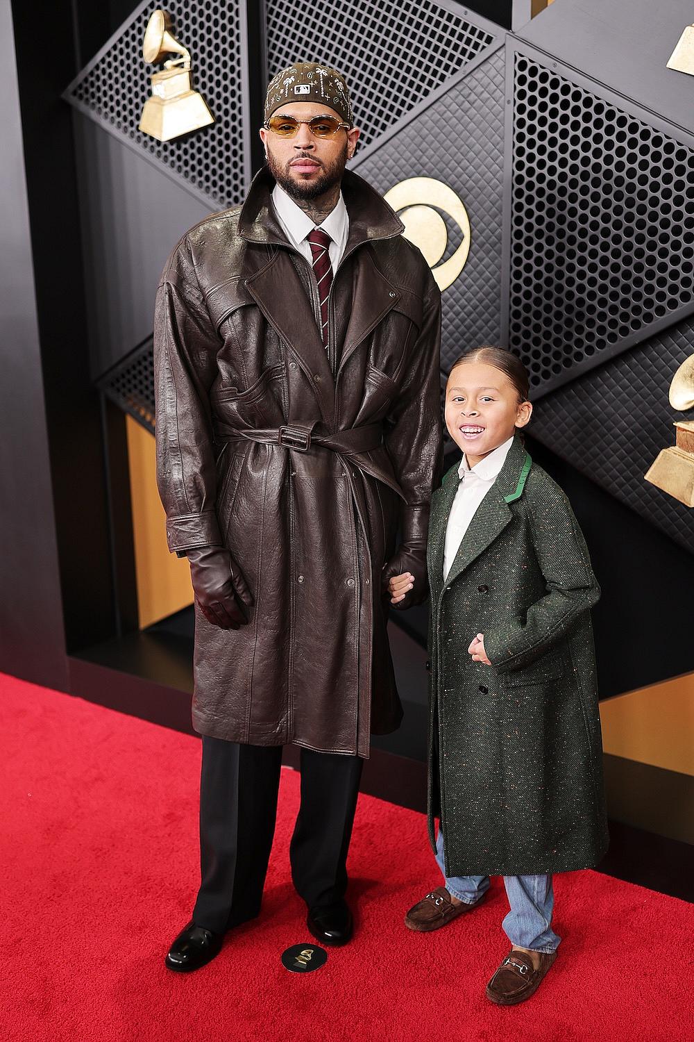 LOS ANGELES, CALIFORNIA - FEBRUARY 01: Chris Brown (L) and a guest attend the 68th GRAMMY Awards on February 01, 2026 in Los Angeles, California.
