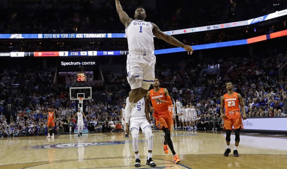 Duke's Zion Williamson (1) goes up to dunk against Syracuse during the first half of an NCAA college basketball game in the Atlantic Coast Conference tournament in Charlotte, N.C., Thursday, March 14, 2019. (AP Photo/Chuck Burton)