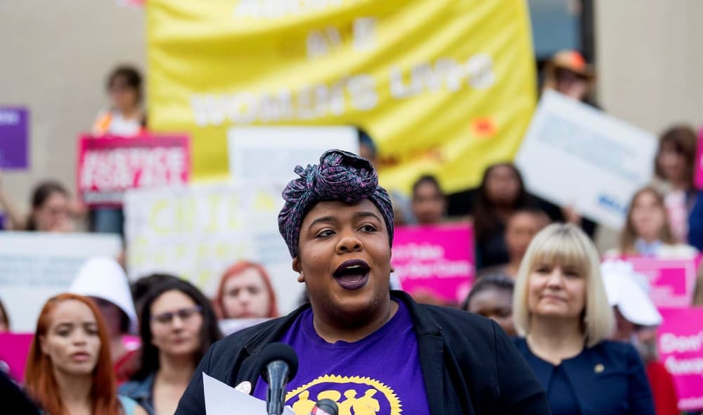 Michelle Wilson, Program Manager for Women Engaged, speaks out against Georgia's restrictive abortion bill and for reproductive justice at a press conference outside of the Georgia State Capitol following the signing of HB 481 in Atlanta, Tuesday, May 7, 2019. Georgia Governor Brian Kemp signed the bill, surrounded by supporters and Georgia lawmakers, in his office Tuesday morning. (ALYSSA POINTER/ALYSSA.POINTER@AJC.COM)