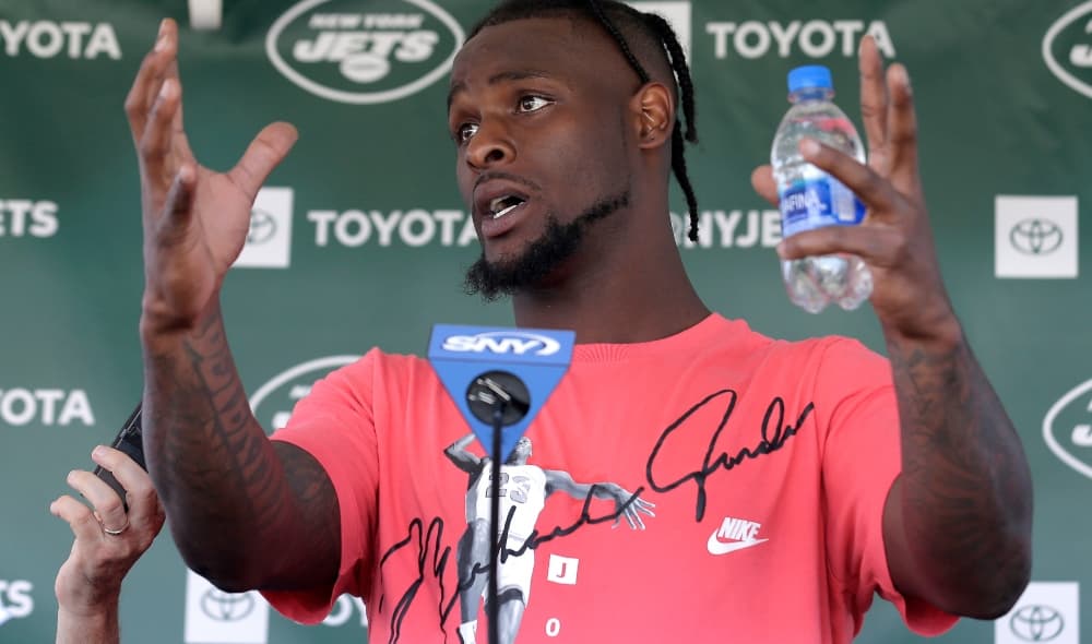New York Jets running back Le'Veon Bell speaks to reporters after a practice at the NFL football team's training camp in Florham Park, N.J., Thursday, July 25, 2019. (AP Photo/Seth Wenig) thegrio.com