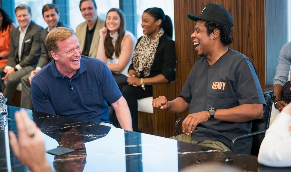 NFL Commissioner Roger Goodell, left, and Jay-Z appear at a news conference at ROC Nation on Wednesday, Aug. 14, 2019 in New York. The NFL and ROC Nation, Jay-Z’s entertainment and sports representation company, announced Tuesday they were teaming up for events and social activism, a deal Jay-Z said had been in the works over the last seven months. (Ben Hider/AP Images for NFL) thegrio.com