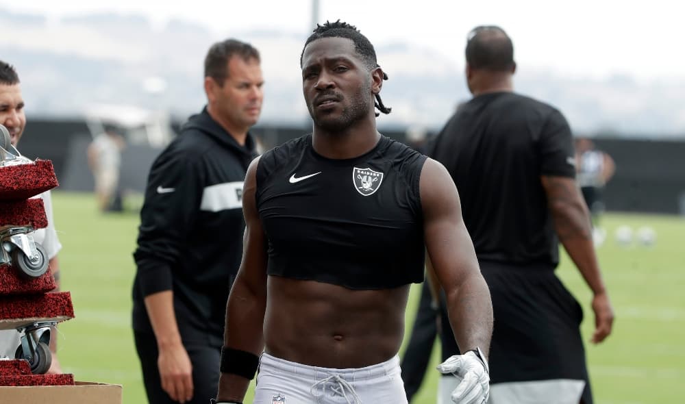 Oakland Raiders' Antonio Brown walks off the field after NFL football practice in Alameda, Calif., Tuesday, Aug. 20, 2019. (AP Photo/Jeff Chiu) thegrio.com