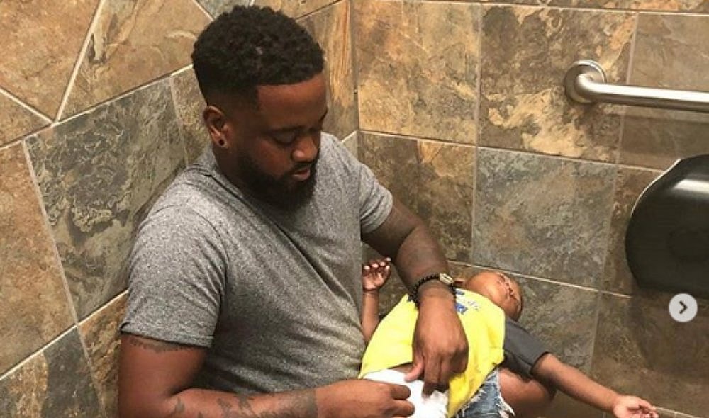 Dad goes viral after posting photo of him changing baby's diaper thegrio.com