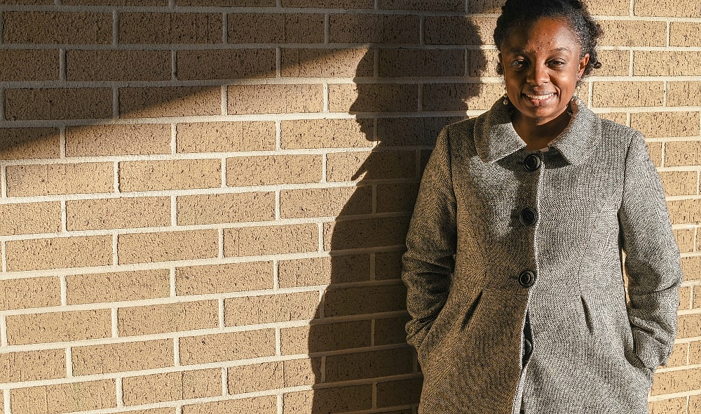 Joycelyn Davis, a direct descendant of Clotilda survivor Charlie Lewis,stands for a portrait at the community center in Africatown in Mobile, Ala., on Tuesday, Jan. 29, 2019. Davis is is organizing the "Spirit of Our Ancestors" festival, a reunion for descendants of Clotilda survivors. “I am so proud to say I am a descendant. That wasn’t a word that I used maybe 10, 15 years ago,” said Davis, 42, a sixth-generation granddaughter of African captive Charlie Lewis. “It was shameful as a child.” (AP Photo/Julie Bennett) thegrio.com
