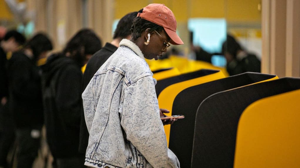 A woman votes at the Anderson Munger Family YMCA vote center