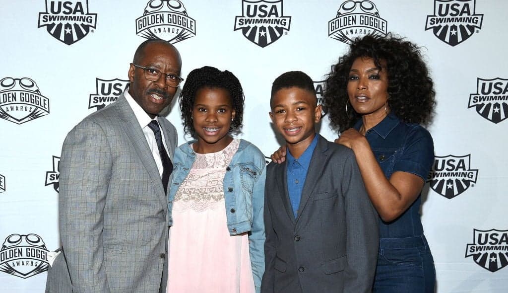 LOS ANGELES, CA - NOVEMBER 19: Courtney B. Vance, Bronwyn Vance, Slater Vance and Angela Bassett attend the 2017 USA Swimming Golden Goggle Awards at J.W. Marriott at L.A. Live on November 19, 2017, in Los Angeles, California. (Photo by Kevork Djansezian) thegrio.com