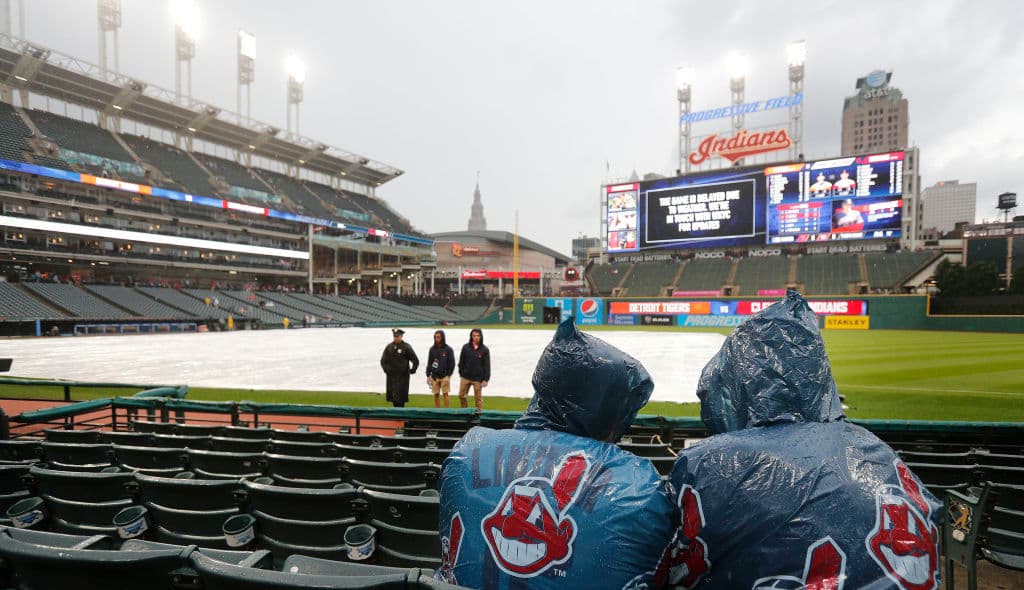 CLEVELAND, OH - JUNE 22: Cleveland Indians fans wait out a rain delay before the start of the game against the Detroit Tigers at Progressive Field on June 22, 2018 in Cleveland, Ohio. (Photo by David Maxwell/Getty Images)