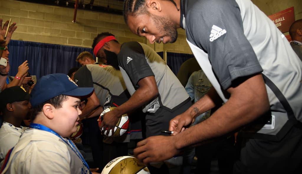 Kawhi Leonard signs autographs during the 66th NBA All-Star Game at Smoothie King Center on February 19, 2017 in New Orleans, Louisiana. (Photo by Kevin Mazur/Getty Images) thegrio.com