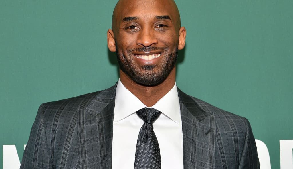 Kobe Bryant Signs Copies Of His Book "Training Camp (The Wizenard Series #1)"