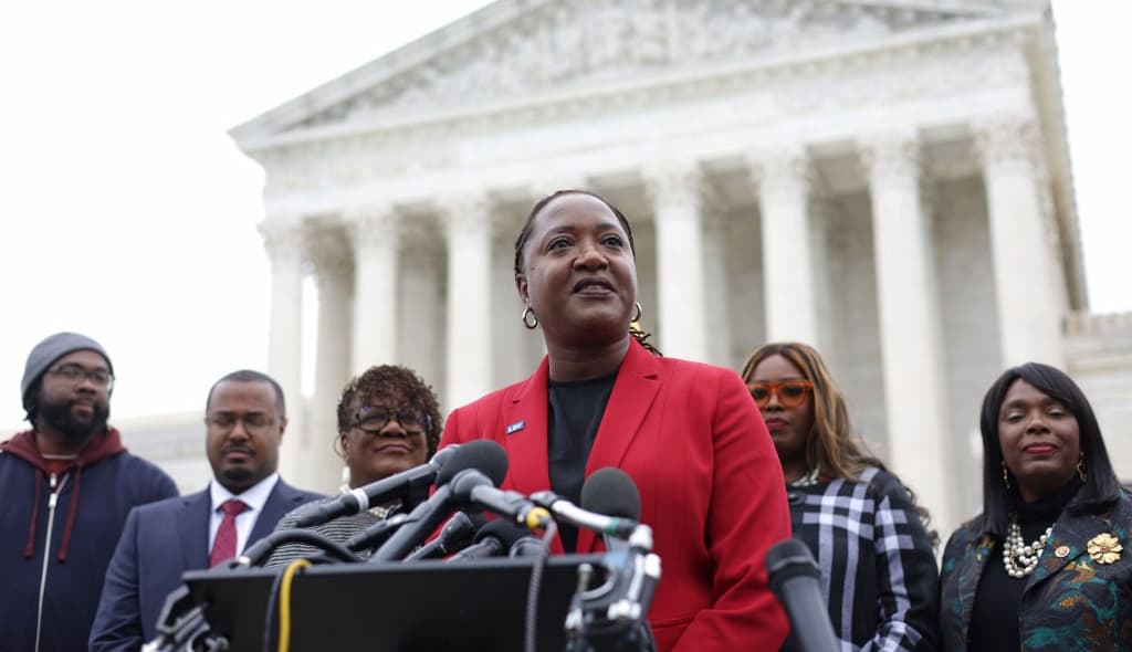 WASHINGTON, DC - OCTOBER 04: President and Director-Counsel of the NAACP Legal Defense Fund (LDF) Janai Nelson (C) speaks to members of the press after the oral argument of the Merrill v. Milligan case at the U.S. Supreme Court on October 4, 2022 in Washington, DC.(Photo by Alex Wong/Getty Images) theGrio.com
