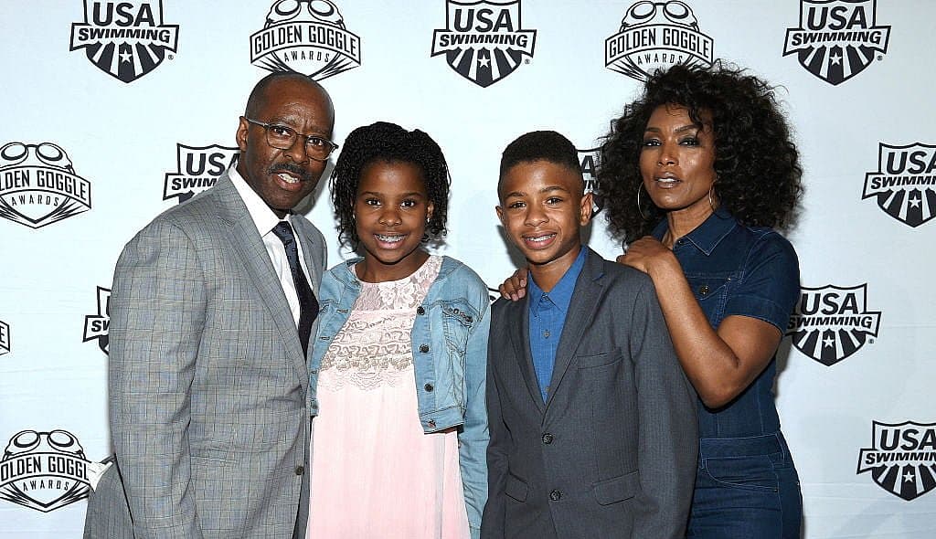 LOS ANGELES, CA - NOVEMBER 19: Courtney B. Vance, Bronwyn Vance, Slater Vance and Angela Bassett attend the 2017 USA Swimming Golden Goggle Awards at J.W. Marriott at L.A. Live on November 19, 2017, in Los Angeles, California. (Photo by Kevork Djansezian) thegrio.com