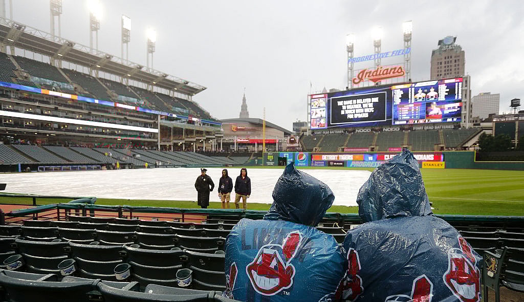 CLEVELAND, OH - JUNE 22: Cleveland Indians fans wait out a rain delay before the start of the game against the Detroit Tigers at Progressive Field on June 22, 2018 in Cleveland, Ohio. (Photo by David Maxwell/Getty Images)