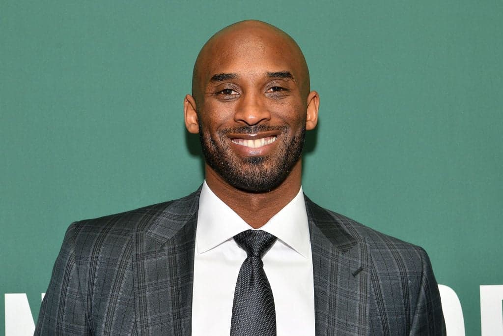 Kobe Bryant Signs Copies Of His Book "Training Camp (The Wizenard Series #1)"