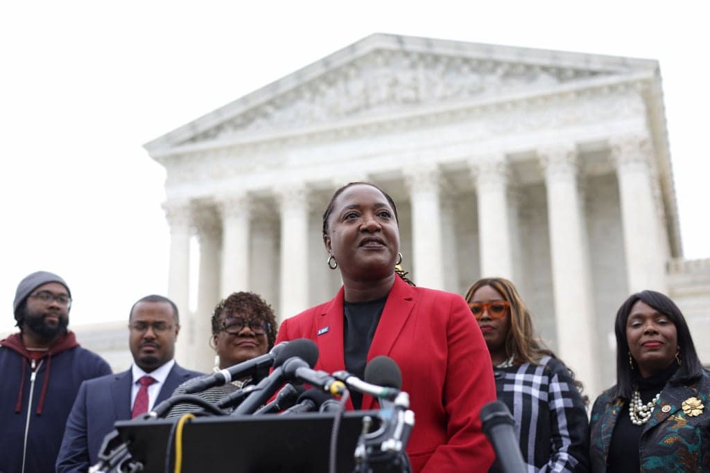 WASHINGTON, DC - OCTOBER 04: President and Director-Counsel of the NAACP Legal Defense Fund (LDF) Janai Nelson (C) speaks to members of the press after the oral argument of the Merrill v. Milligan case at the U.S. Supreme Court on October 4, 2022 in Washington, DC.(Photo by Alex Wong/Getty Images) theGrio.com