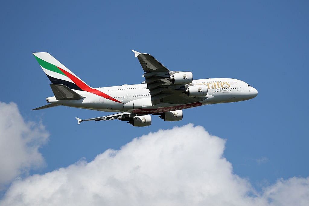 Emirates COVID-19 insurance travel thegrio.com