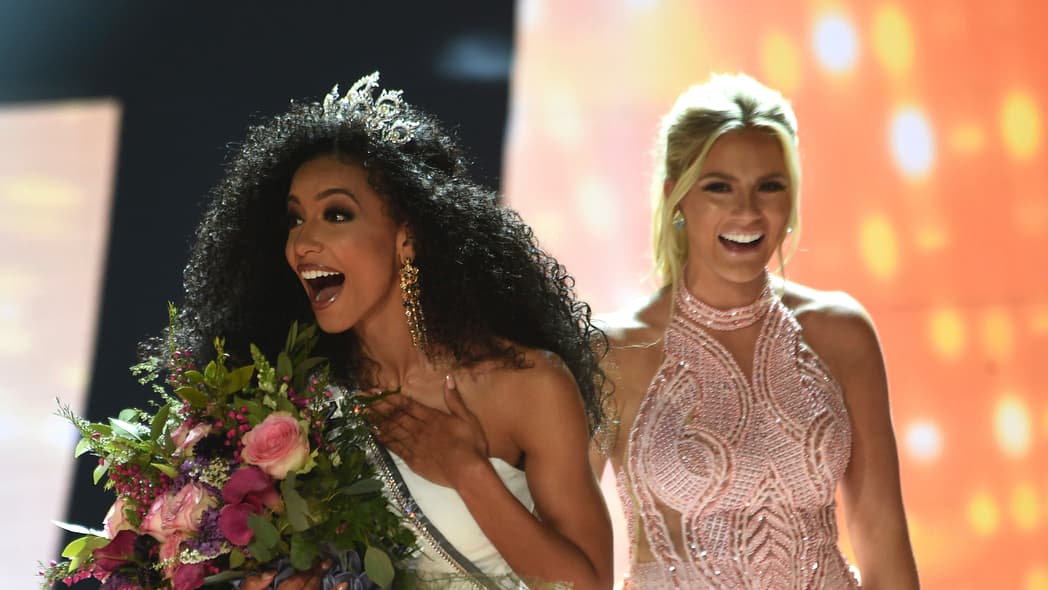 Miss North Carolina Cheslie Kryst, left, gets crowned by last year's winner Sarah Rose Summers, right, after winning the 2019 Miss USA final competition in the Grand Theatre in the Grand Sierra Resort in Reno, Nev., on Thursday, May 2, 2019. Kryst, a 27-year-old lawyer from North Carolina who represents some prison inmates for free, won the 2019 Miss USA title Thursday night in a diverse field that included teachers, nurses and members of the military. (Jason Bean/The Reno Gazette-Journal via AP) thegrio.com