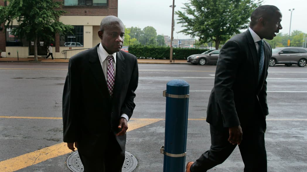 Former FBI agent William Don Tisaby, left, is accompanied by attorney Jermaine Wooten as he turns himself in at St. Louis Police headquarters on Monday, June 17, 2019, in St Louis. Tisaby has been charged in a perjury investigation related to the prosecution of former Missouri Gov. Eric Greitens. (Robert Cohen/St. Louis Post-Dispatch via AP)