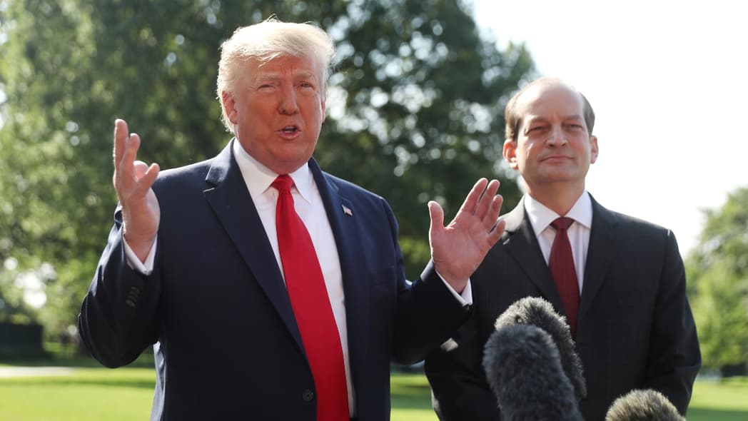 President Donald Trump speaks to members of the media with Secretary of Labor Alex Acosta on the South Lawn of the White House, Friday, July 12, 2019, before Trump boards Marine One for a short trip to Andrews Air Force Base, Md. and then on to Wisconsin. (AP Photo/Andrew Harnik)