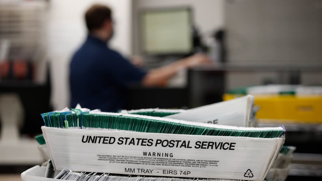 Utah County Election workers stack ballots in the election office that were picked up at a United States Postal Service office to be processed on October 26, 2020 in Provo, Utah. (Photo by George Frey/Getty Images) theGrio.com