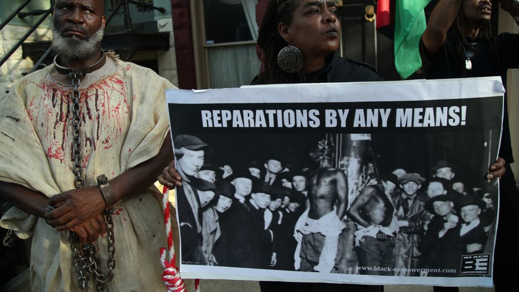 Activist Groups Protest Against Senate Majority Leader McConnell On National Reparations Day