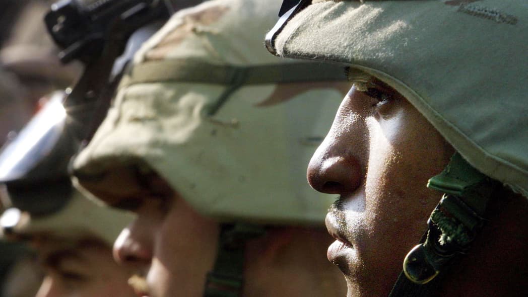 U.S. Army 101st Airborne Division E4 Bobby with other soldiers